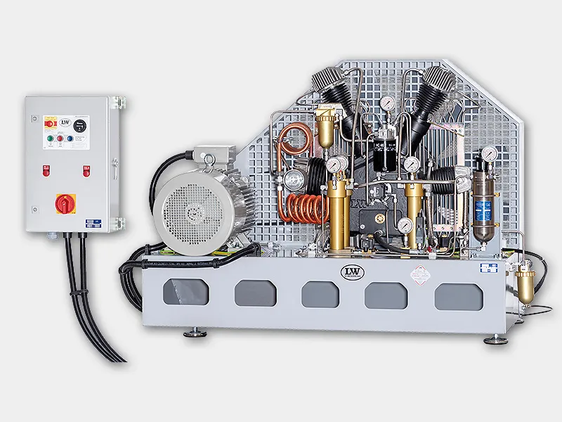 LW 720 E high-pressure electric air compressor featuring multi-stage cylinders, copper intercooler coils, and control panel for continuous breathing-air or SCUBA tank filling operations.